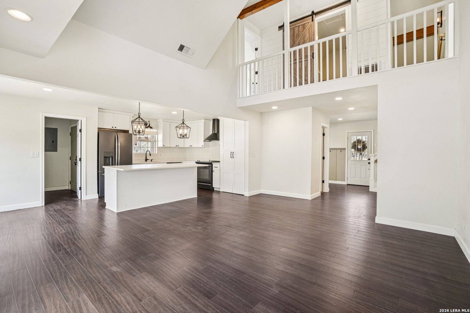 706 Quail Run Lytle, TX 78052 - Photo 11 of 51 a view of kitchen with furniture and wooden floor