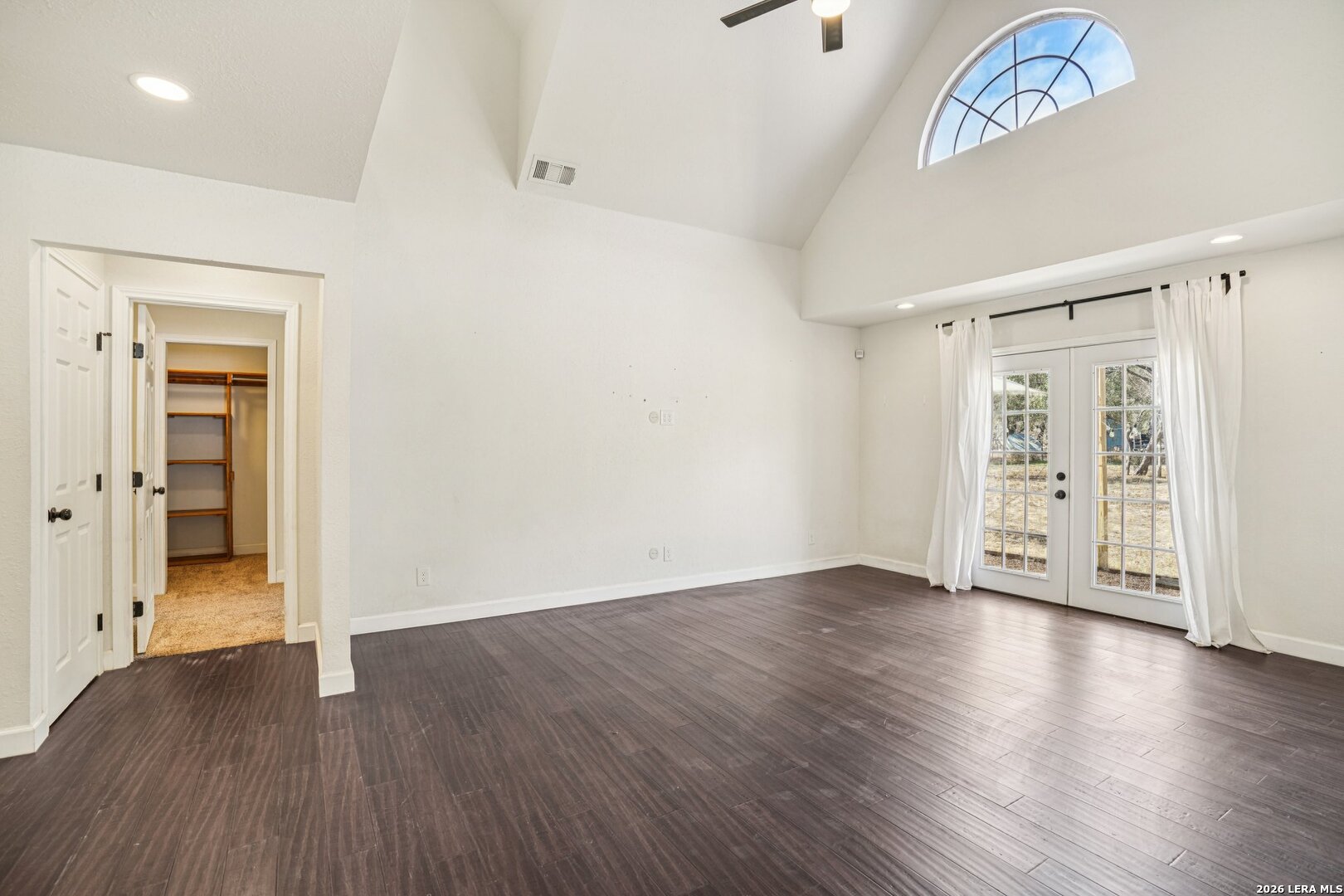 706 Quail Run Lytle, TX 78052 - Photo 12 of 51 a view of an empty room with wooden floor