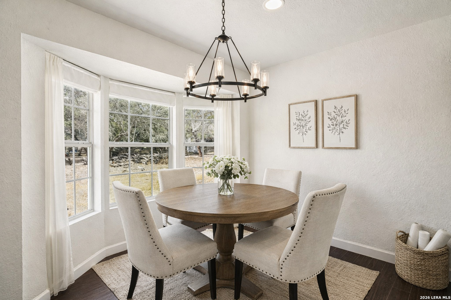 706 Quail Run Lytle, TX 78052 - Photo 15 of 51 a dining room with furniture a window and a chandelier