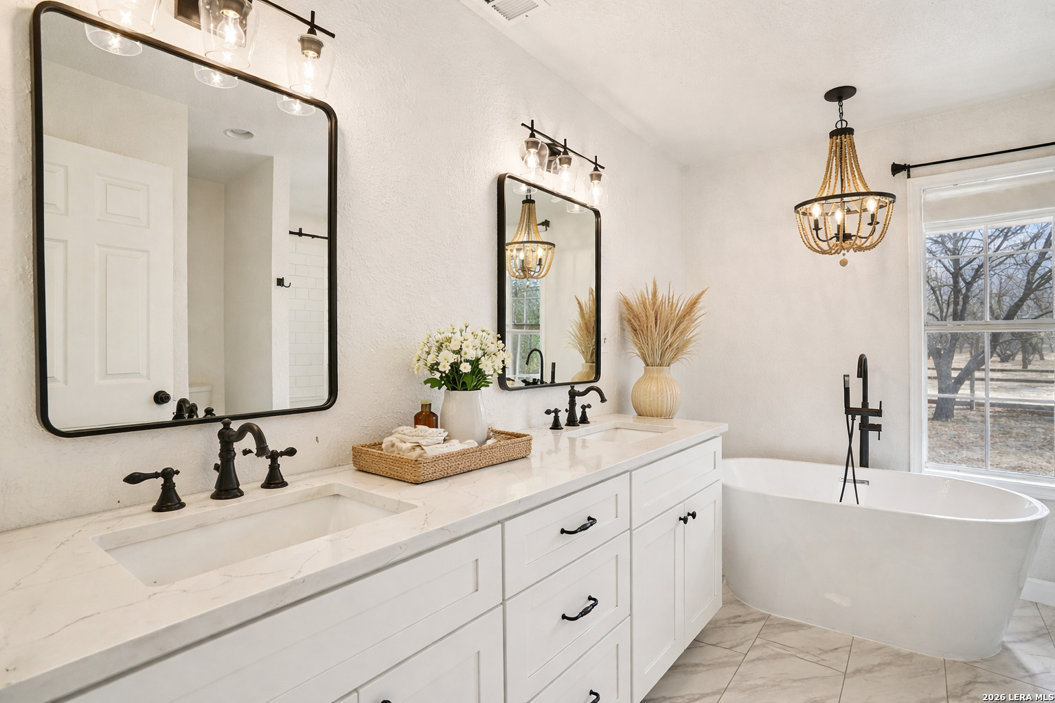 706 Quail Run Lytle, TX 78052 - Photo 23 of 51 a bathroom with a double vanity sink mirror and