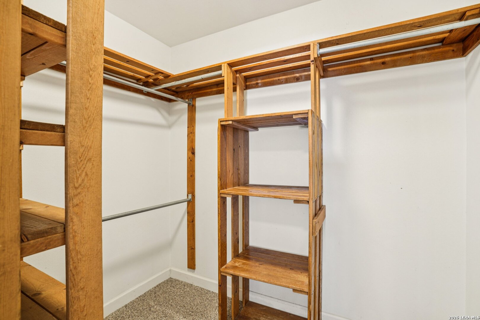 706 Quail Run Lytle, TX 78052 - Photo 25 of 51 a view of walk in closet with clothes and shoes