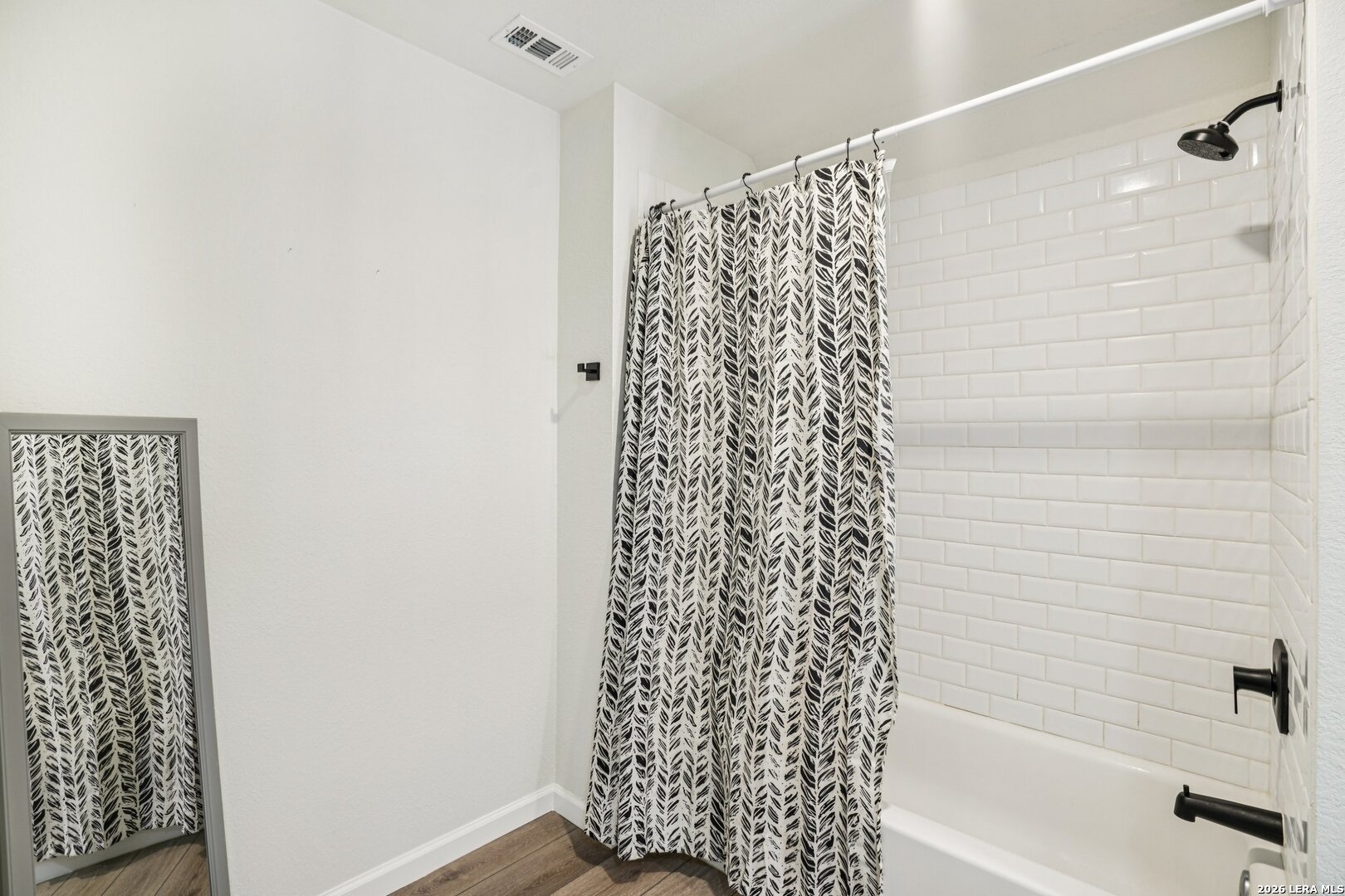 706 Quail Run Lytle, TX 78052 - Photo 35 of 51 a bathroom with a bathtub and shower