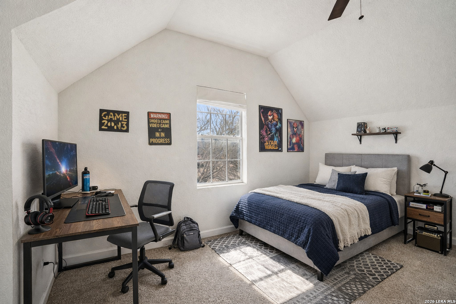 706 Quail Run Lytle, TX 78052 - Photo 36 of 51 a bedroom with a bed a desk and chair next to a window