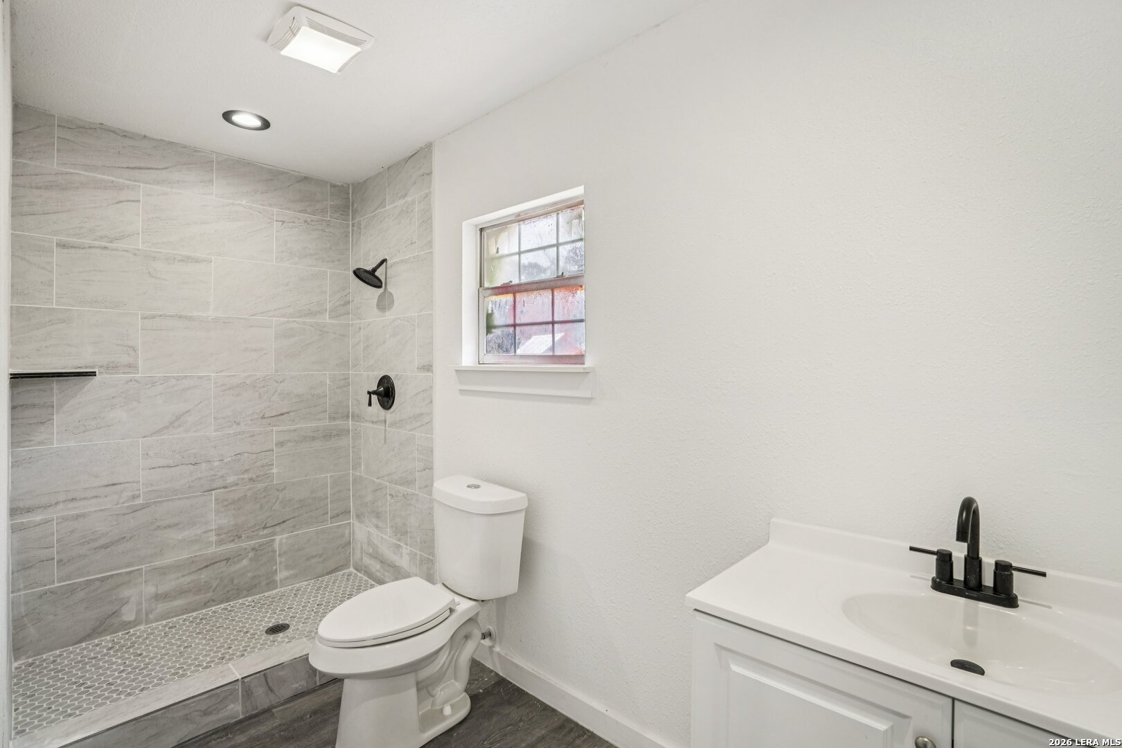 706 Quail Run Lytle, TX 78052 - Photo 43 of 51 a bathroom with a sink a toilet and shower