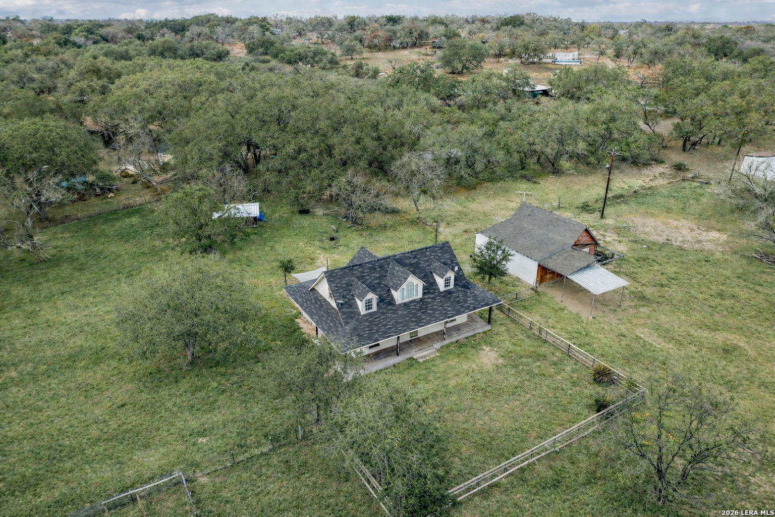 706 Quail Run Lytle, TX 78052 - Photo 49 of 51 an aerial view of a house with a yard