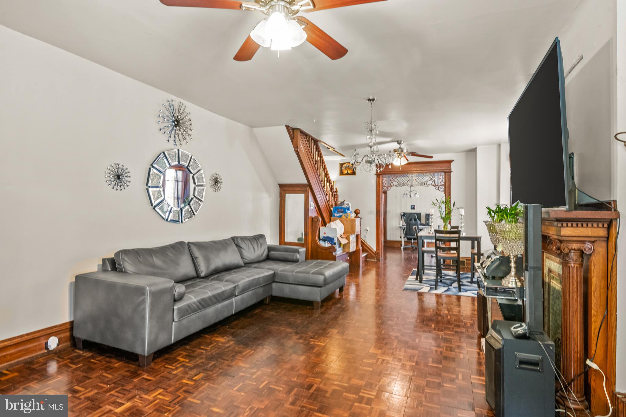 1562 Mineral Spring Road Reading, PA 19602 - Photo 7 of 28 a living room with fireplace furniture and a flat screen tv
