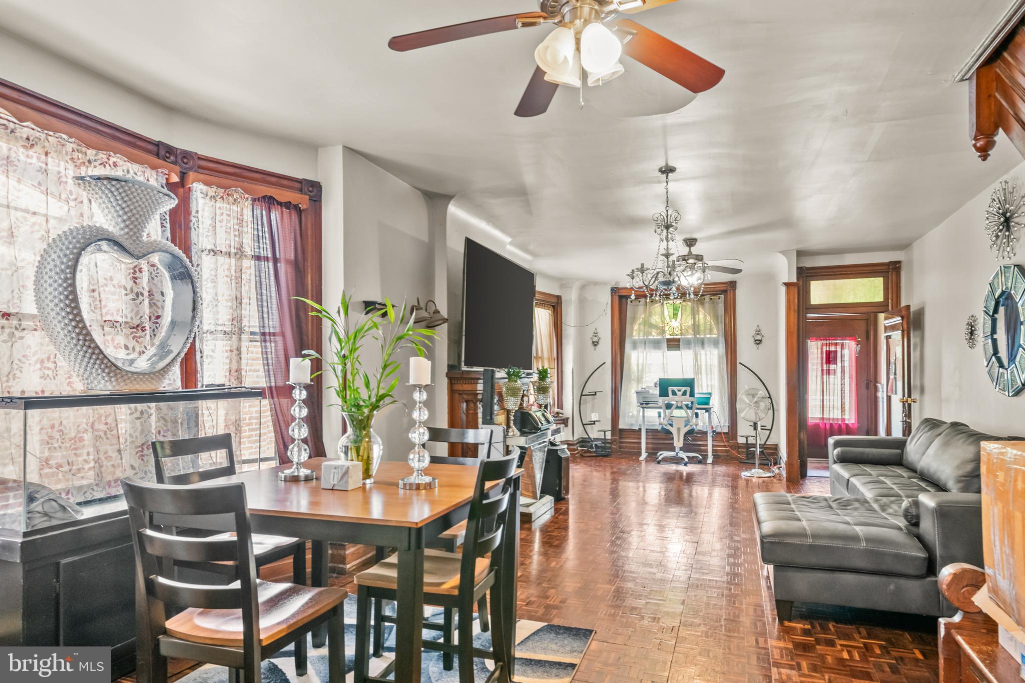 1562 Mineral Spring Road Reading, PA 19602 - Photo 8 of 28 a dining room with furniture a chandelier and a rug