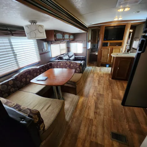 a bedroom with a bed and large mirror