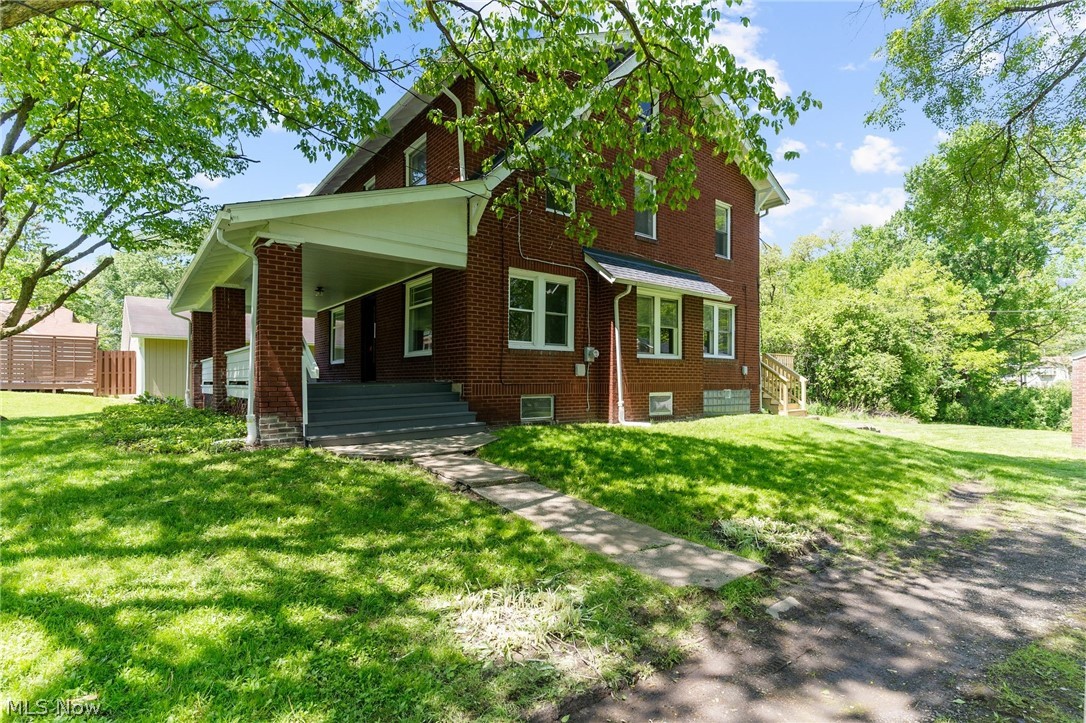 4646 Kirk Road Youngstown, OH 44515 - Photo 1 of 18 View of front facade featuring a front yard