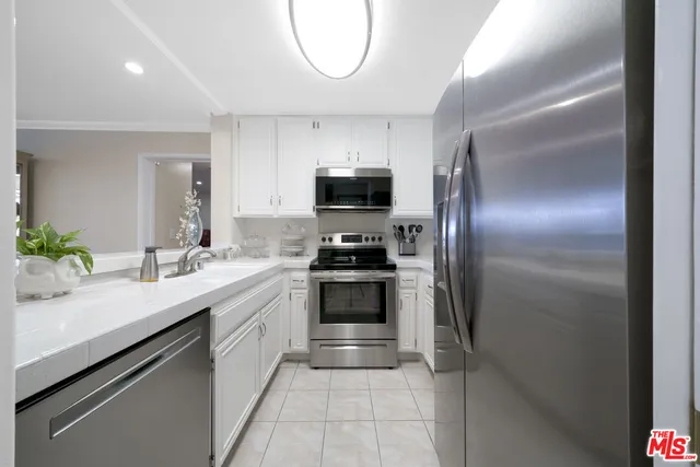 a kitchen with a sink and a stove