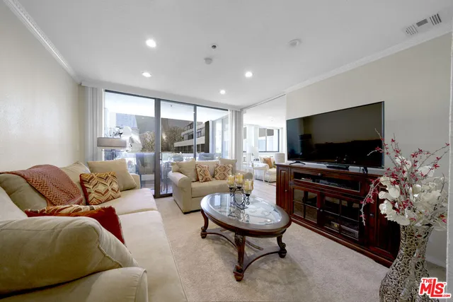 a bathroom with a double vanity sink toilet and shower