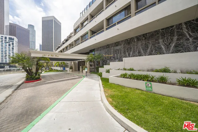 a view of a building with a yard