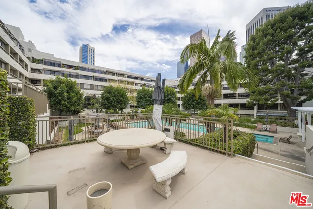 a view of living room filled with furniture and flowers