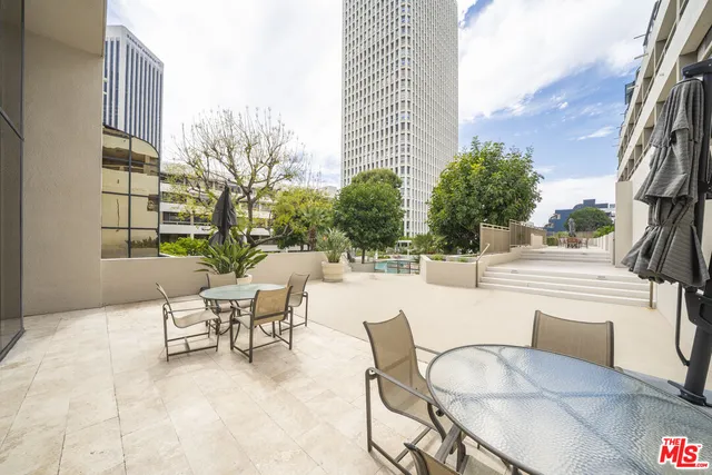 a backyard of a house with plants and trees