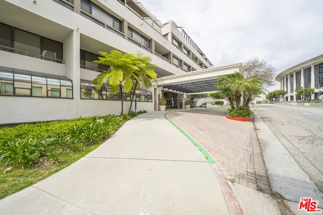 a view of a building with a yard