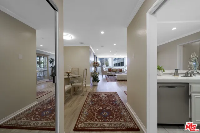 a bathroom with a sink a mirror and a glass door