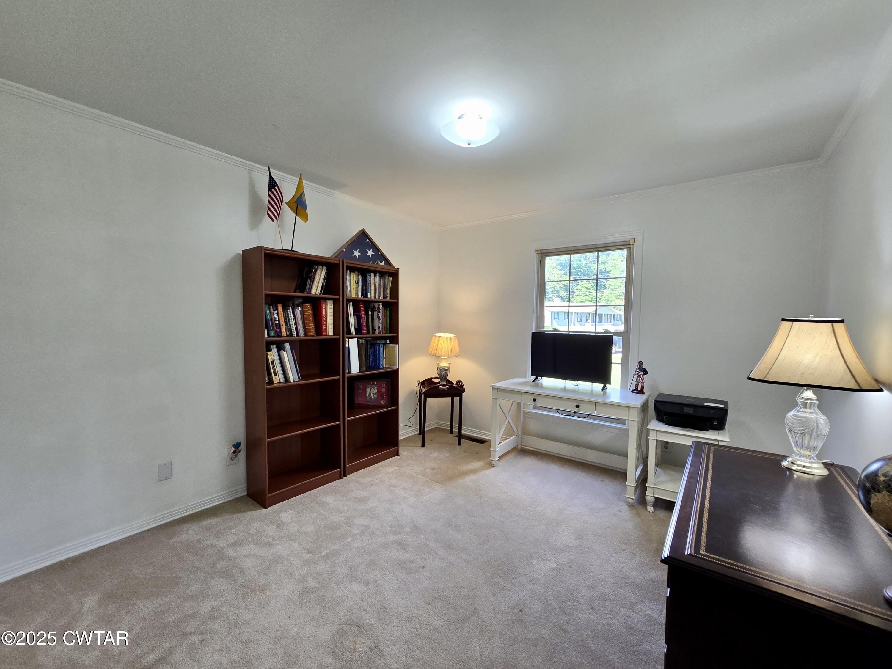 2 Ayers Drive Jackson, TN 38301 - Photo 12 of 17 a living room with furniture and a lamp