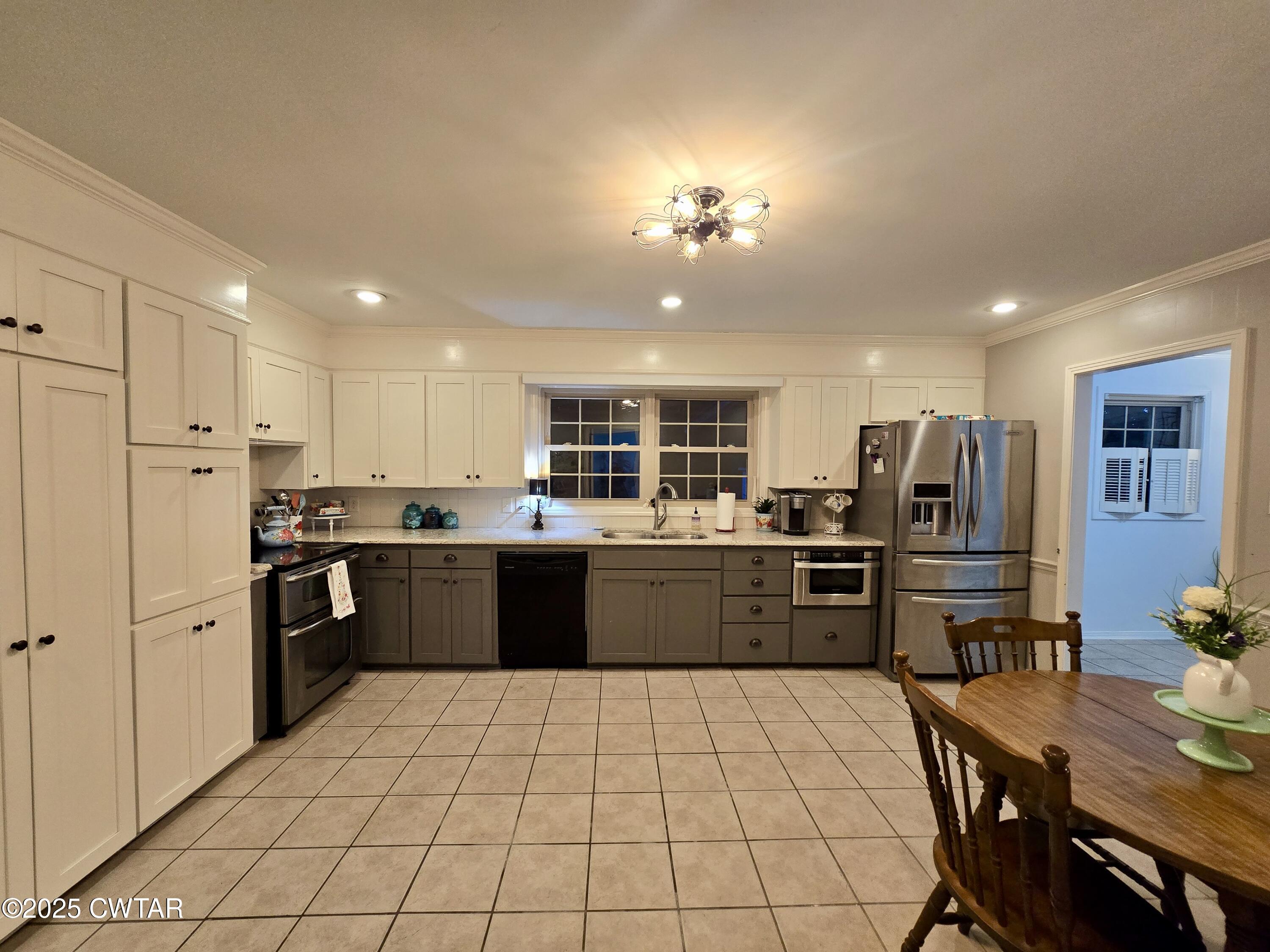 2 Ayers Drive Jackson, TN 38301 - Photo 2 of 17 a large kitchen with a large counter top appliances and cabinets