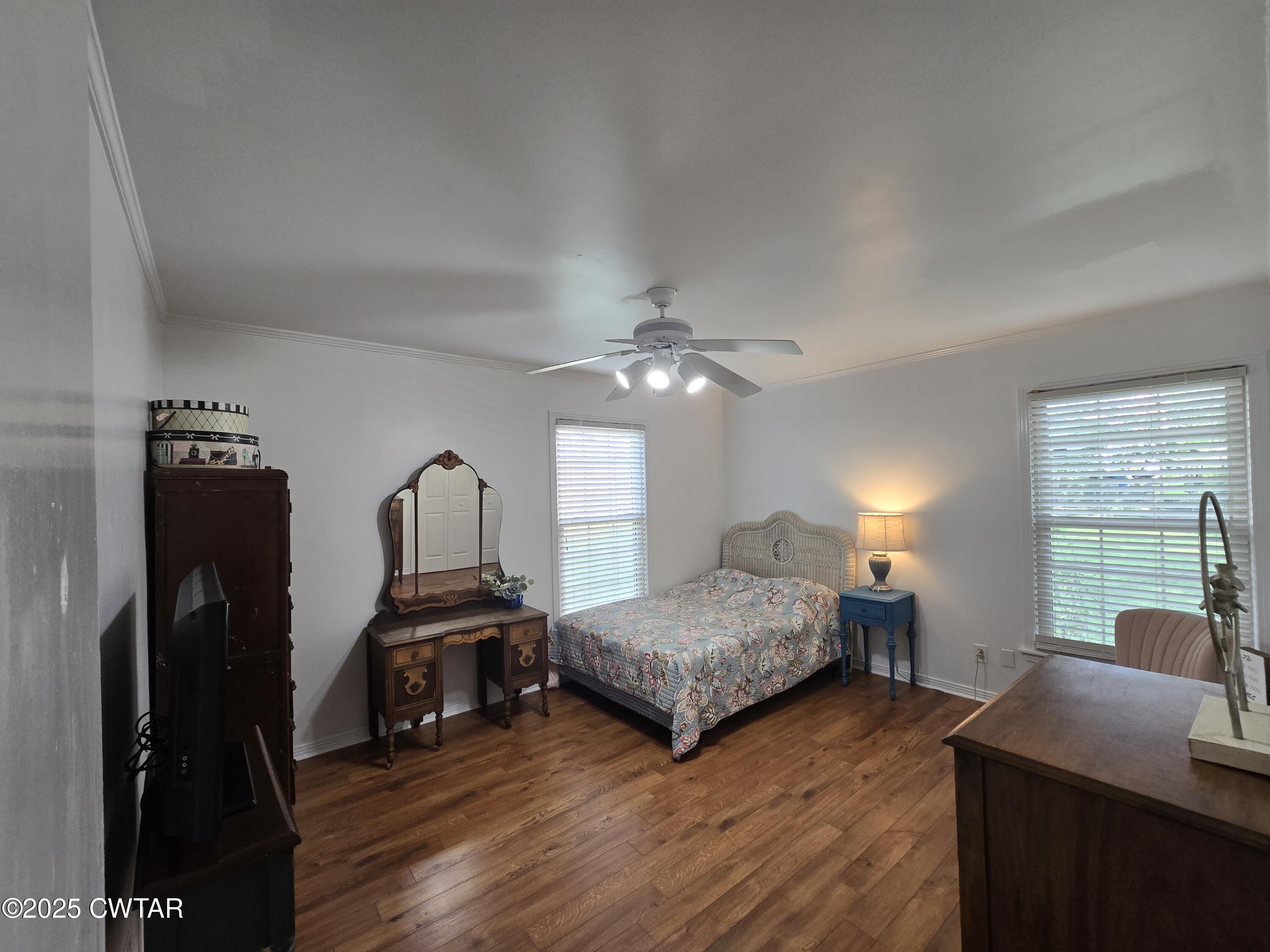 2 Ayers Drive Jackson, TN 38301 - Photo 10 of 17 a bedroom with two bed and a chandelier