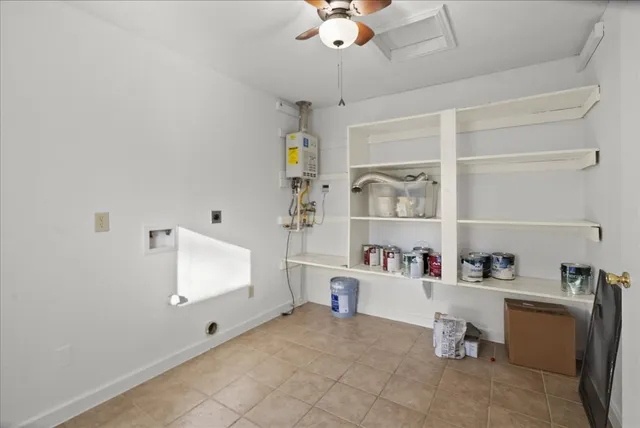 a room with a cabinets and a window