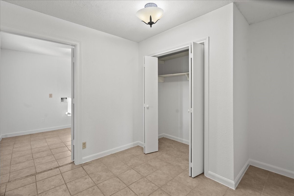 105 Alice Street Anahuac, TX 77514 - Photo 18 of 36 a view of an empty room