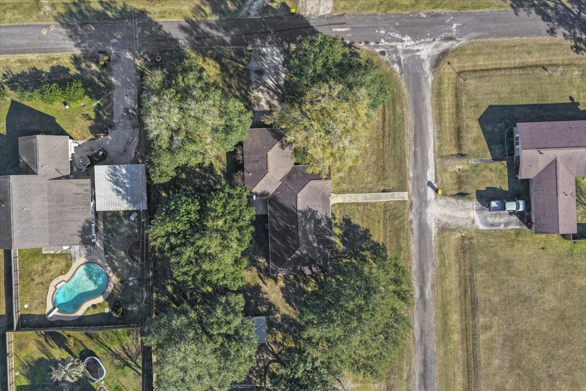 105 Alice Street Anahuac, TX 77514 - Photo 35 of 36 an aerial view of a house with outdoor space