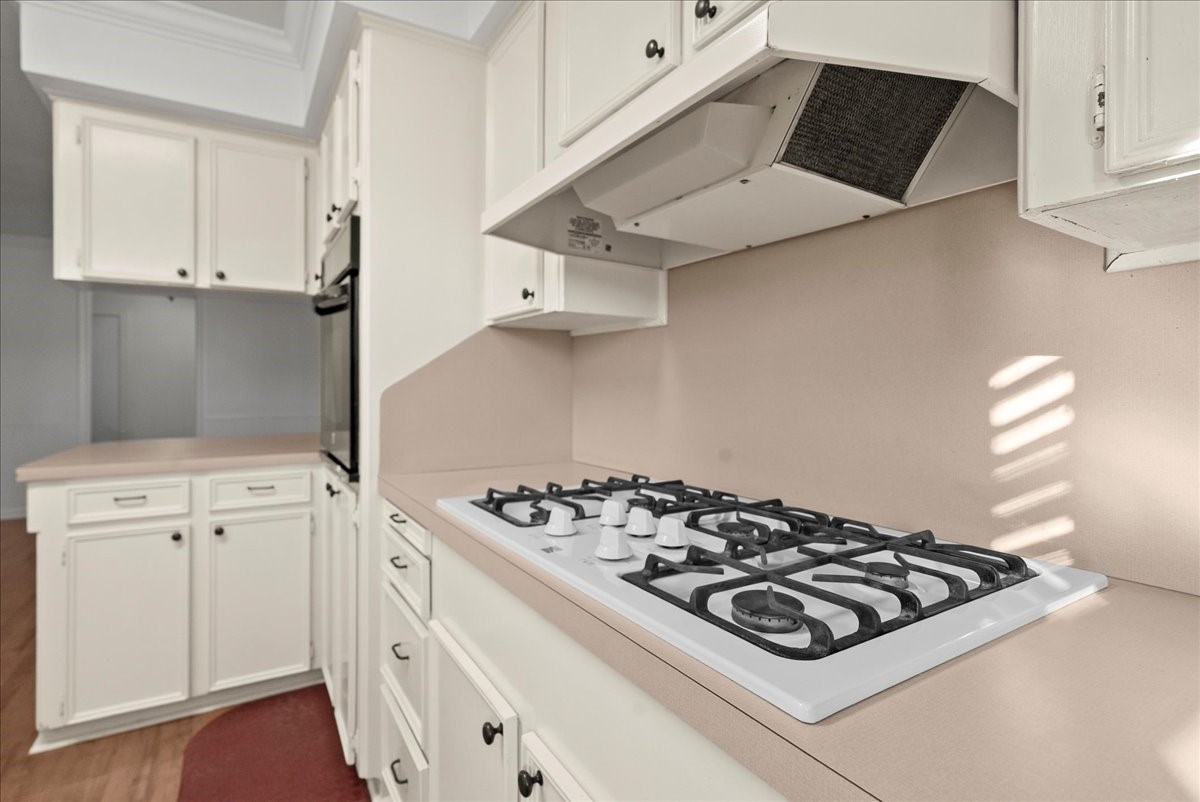 105 Alice Street Anahuac, TX 77514 - Photo 9 of 36 a white stove top oven sitting inside of a kitchen