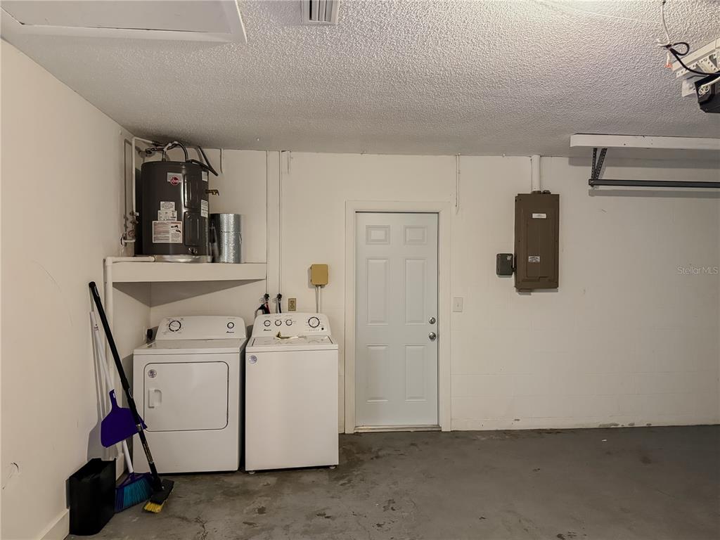 5364 Deltona Boulevard Spring Hill, FL 34606 - Photo 36 of 36 a utility room with dryer and washer