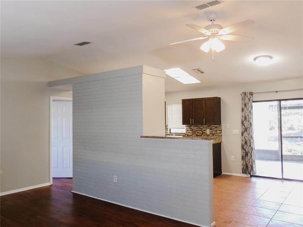 5364 Deltona Boulevard Spring Hill, FL 34606 - Photo 5 of 36 a view of a kitchen with a sink and a window