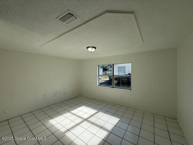 809 Poplar Lane Melbourne, FL 32901 - Photo 5 of 21 an empty room with windows