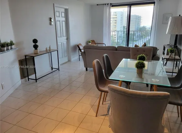 a view of a dining room with furniture window and outside view
