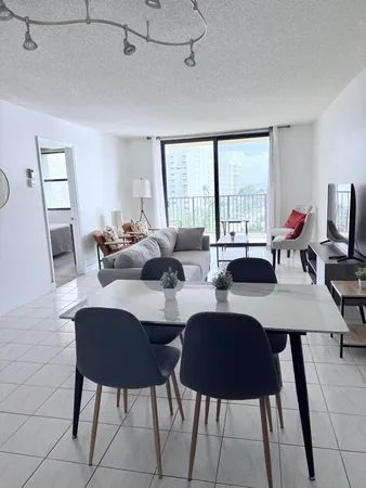 a view of a dining room with furniture window and outside view