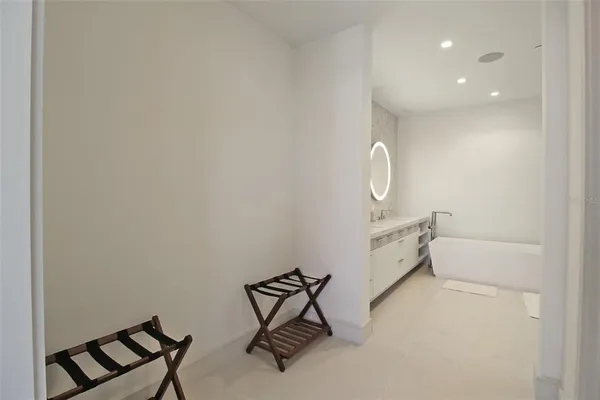a living room with a couch and a table with wooden floor