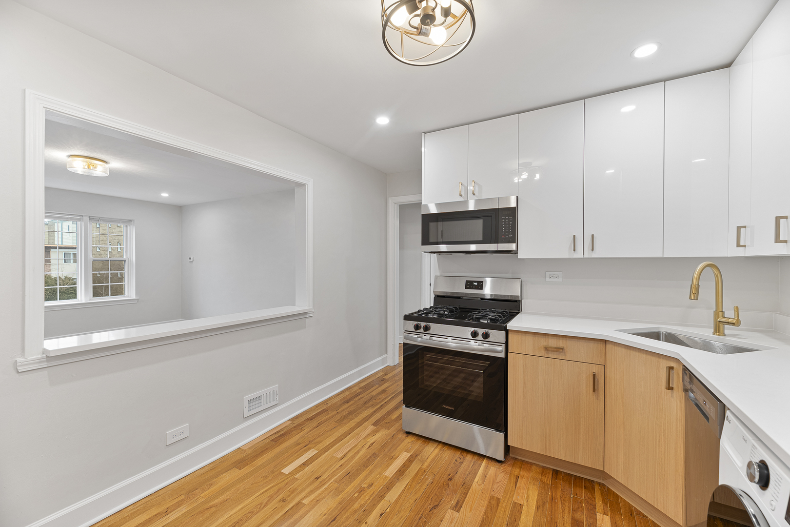 132 Ridge Avenue, Unit 2 Evanston, IL 60202 - Photo 6 of 14 a kitchen with granite countertop a stove and a sink