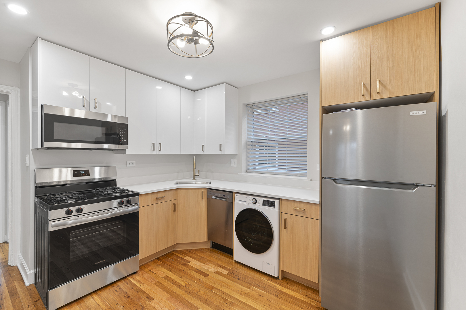 132 Ridge Avenue, Unit 2 Evanston, IL 60202 - Photo 7 of 14 a kitchen with a refrigerator and a stove top oven