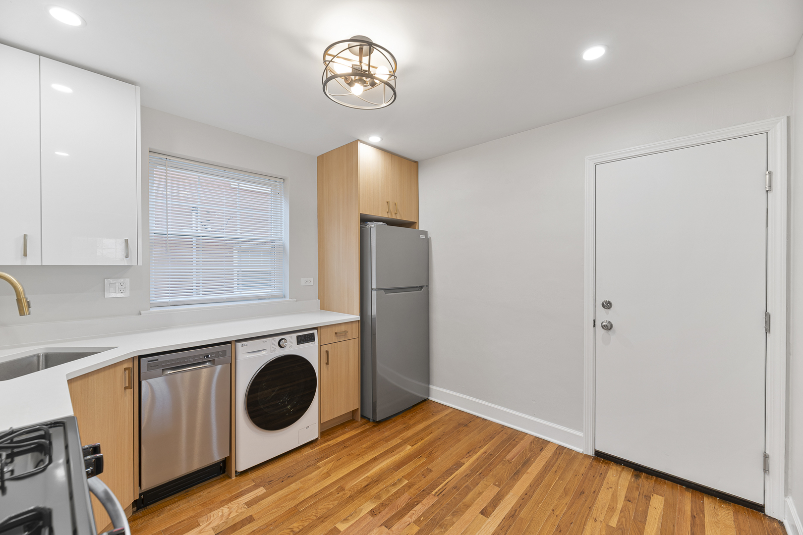 132 Ridge Avenue, Unit 2 Evanston, IL 60202 - Photo 8 of 14 a view of a kitchen with a washer and dryer