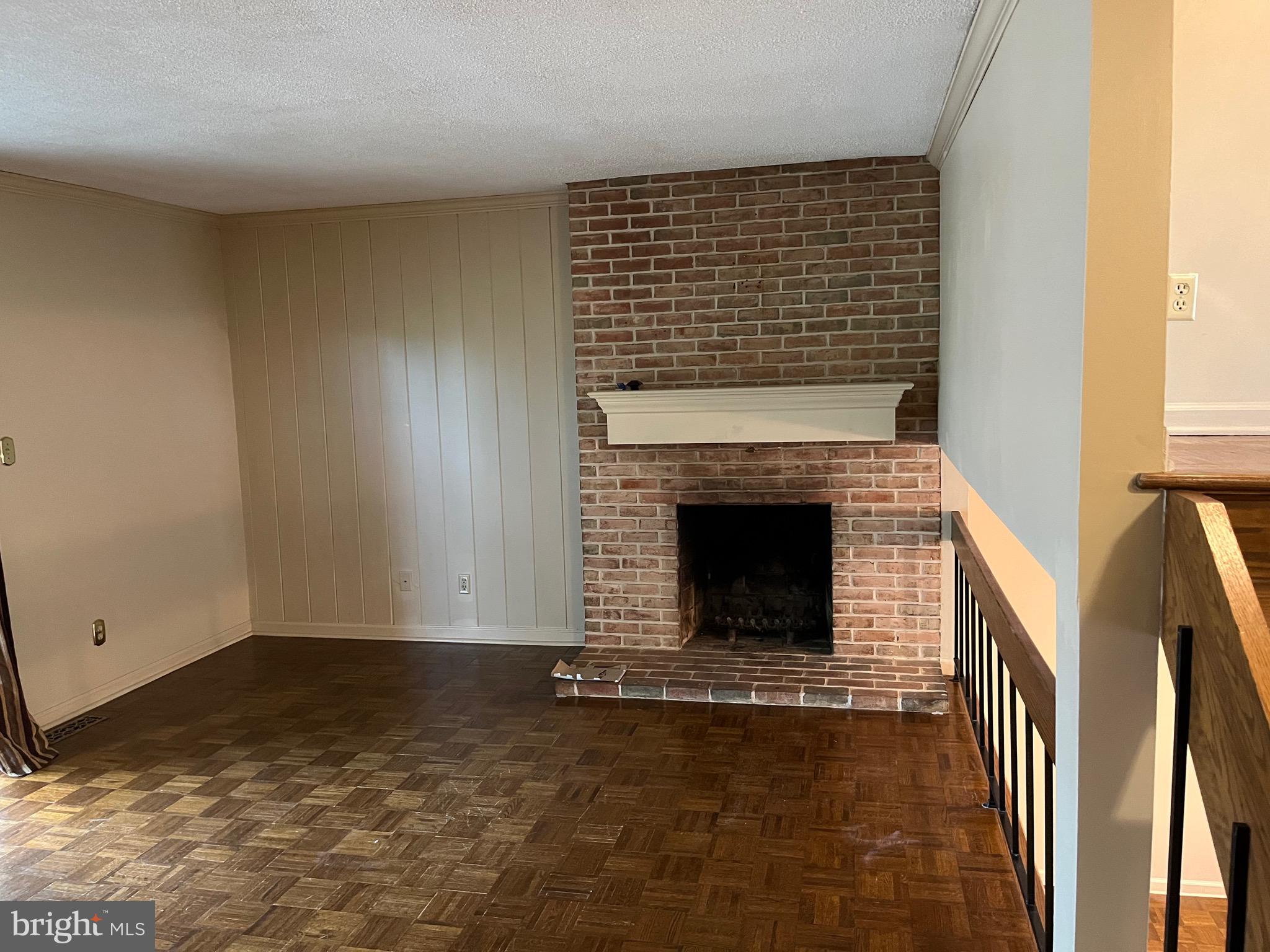 70 Winged Foot Drive Reading, PA 19607 - Photo 5 of 19 a view of empty room with fireplace and wooden floor
