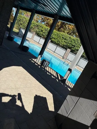 a view of a swimming pool with an outdoor space
