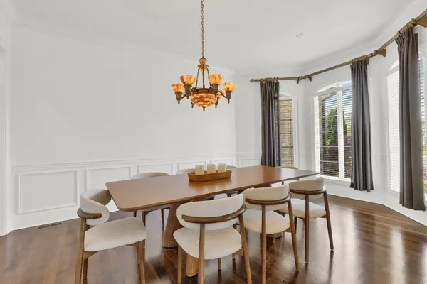 a kitchen with stainless steel appliances a sink a stove a refrigerator and cabinets