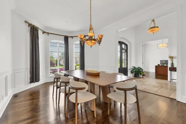 a kitchen with stainless steel appliances granite countertop a sink a stove and a refrigerator