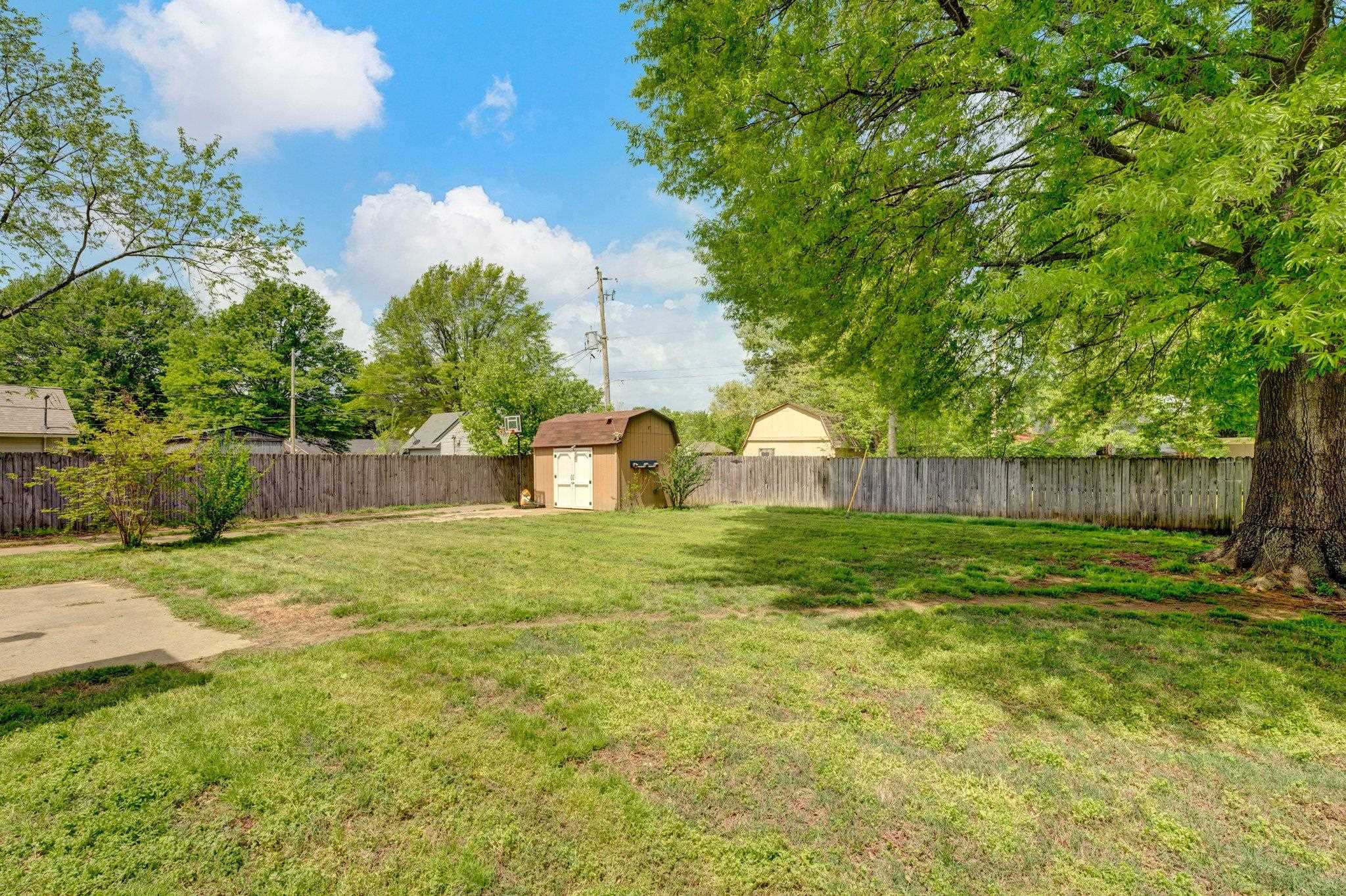 7168 Reese Road Memphis, TN 38133 - Photo 16 of 18 Concrete Patio, Storage shed and utility closet, Concrete Drive extends to backyard too!