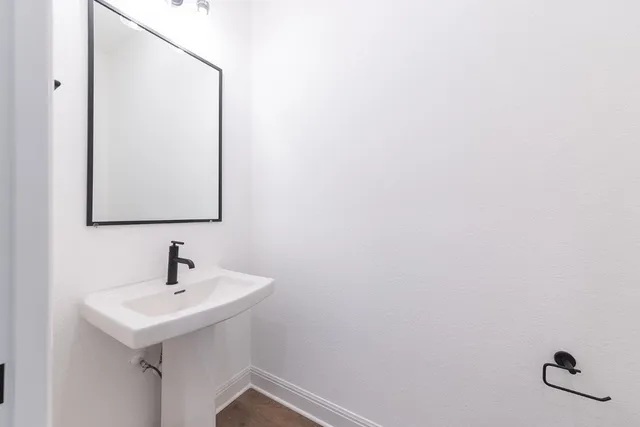 a bathroom with a sink and mirror