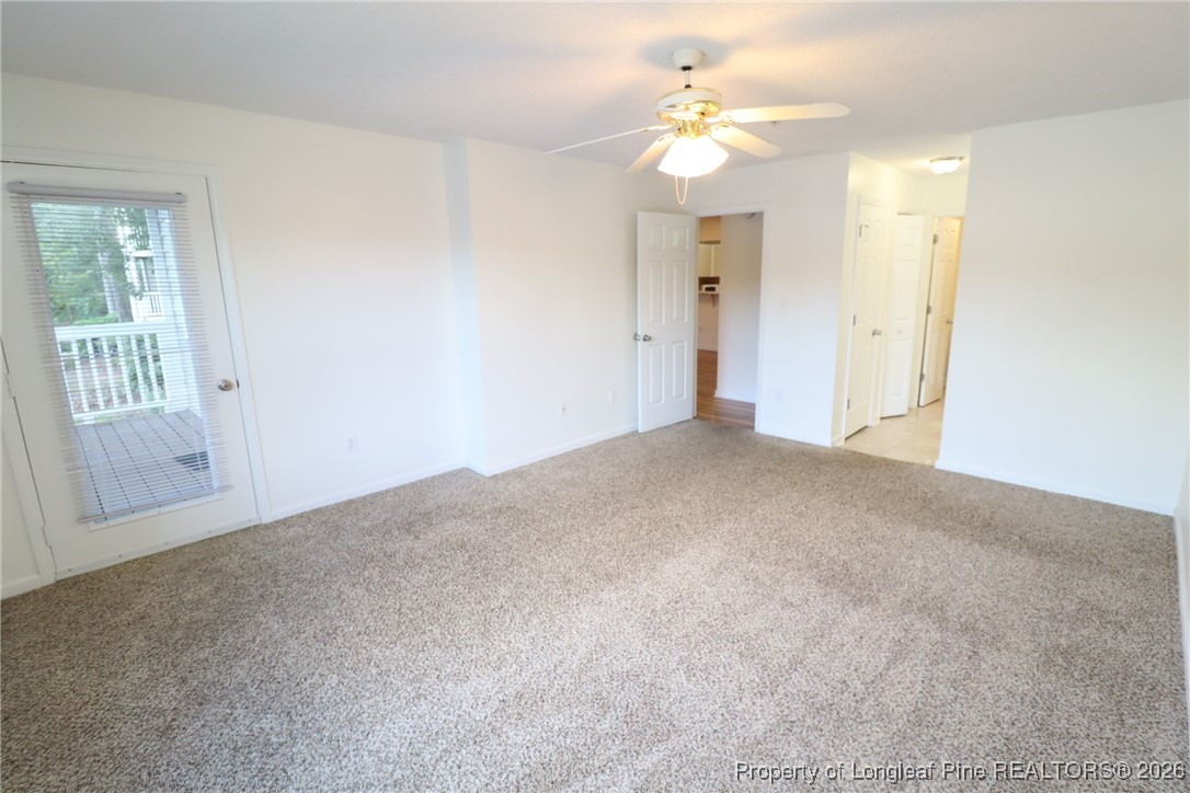 510 Springfork Drive, Unit 510 Cary, NC 27513 - Photo 14 of 25 a view of a big room with windows and chandelier fan
