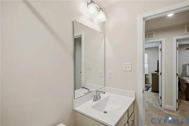 a bathroom with a sink a mirror and a shower