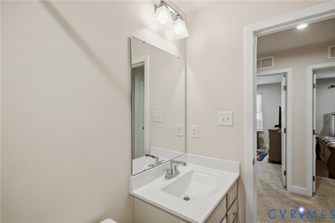 4124 Jefferson Rdg Drive Midlothian, VA 23112 - Photo 28 of 43 Full bath with vanity and light LVP