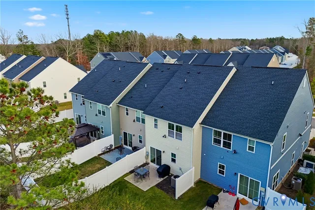 a aerial view of a house with a yard