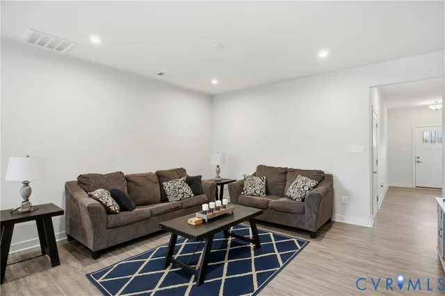 a living room with furniture and a rug