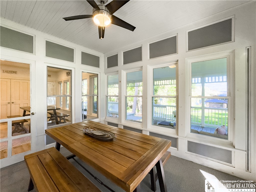 4988 West Lake Road Chautauqua, NY 14757 - Photo 10 of 44 it opens to an enclosed dining porch - lined with