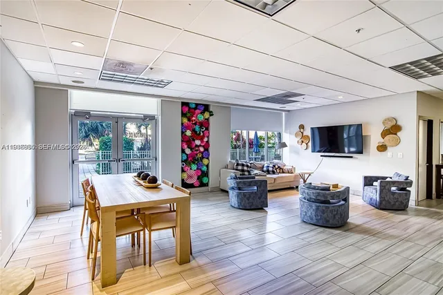 a view of a dinning table and chairs in a patio