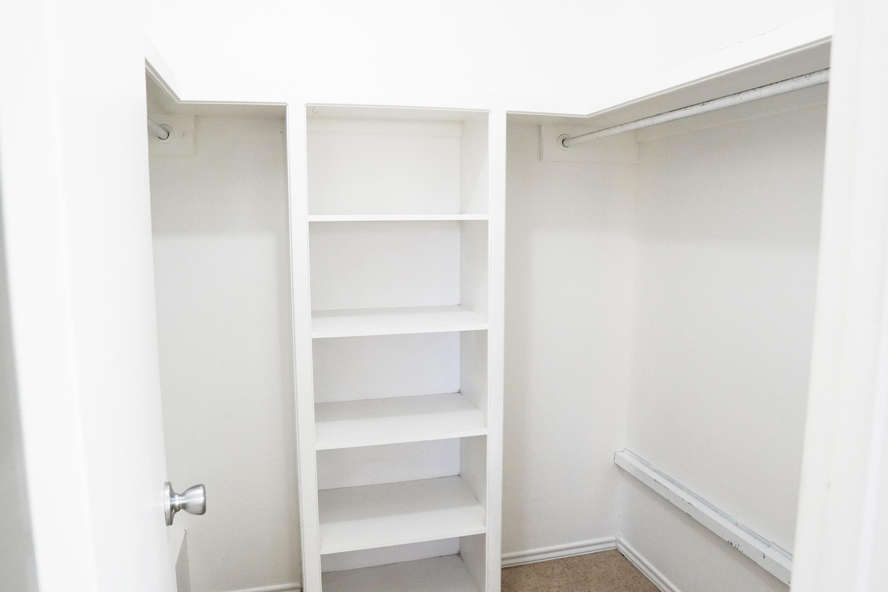 5520 80th Street Lubbock, TX 79424 - Photo 20 of 29 a view of an empty walk in closet